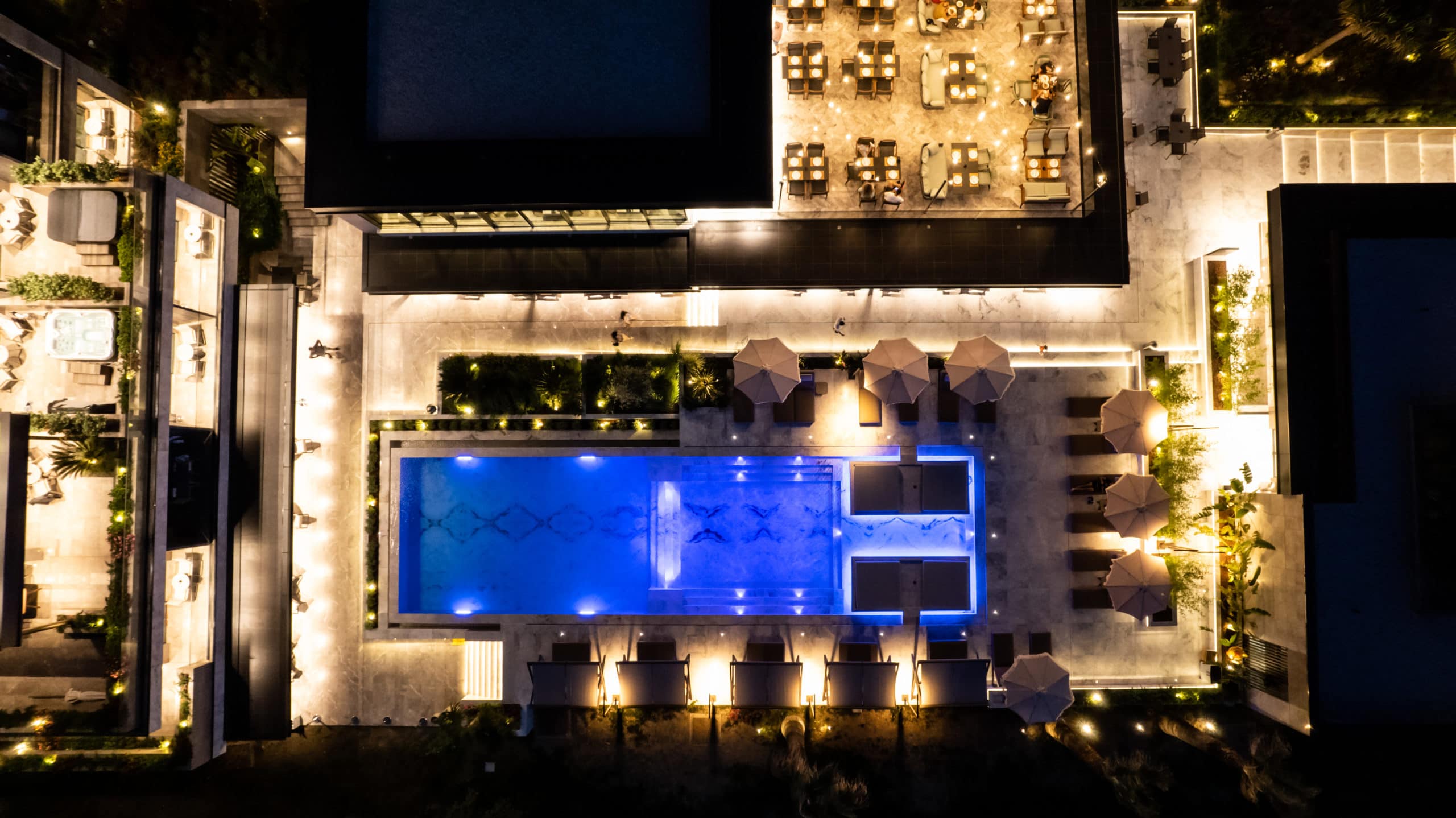 prado_hotel_pool_view_from_above_at_night