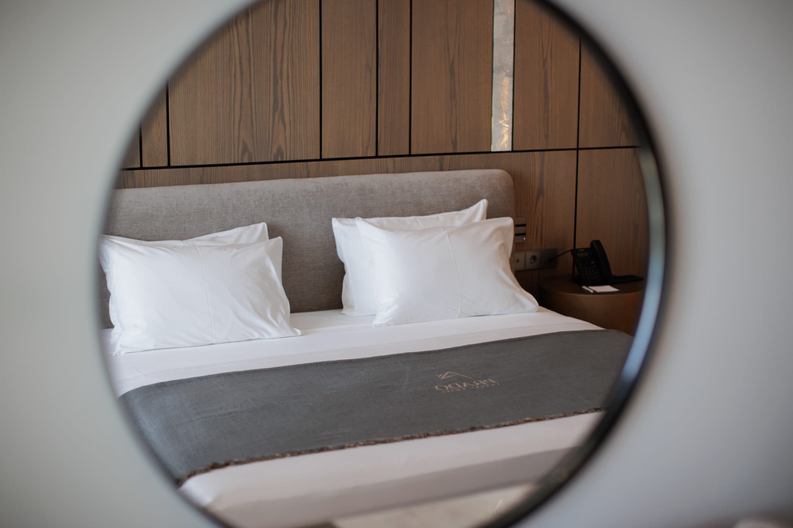 prado_luxury_hotel_room_bed_mirror_view